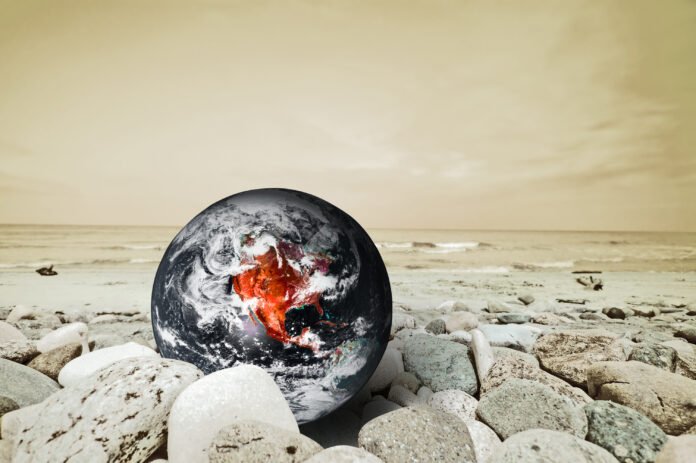 foto AI della sfera terrestre poggiata su una spiaggia